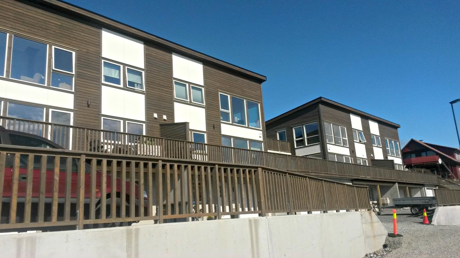 Two new apartment buildings with long timber balconies